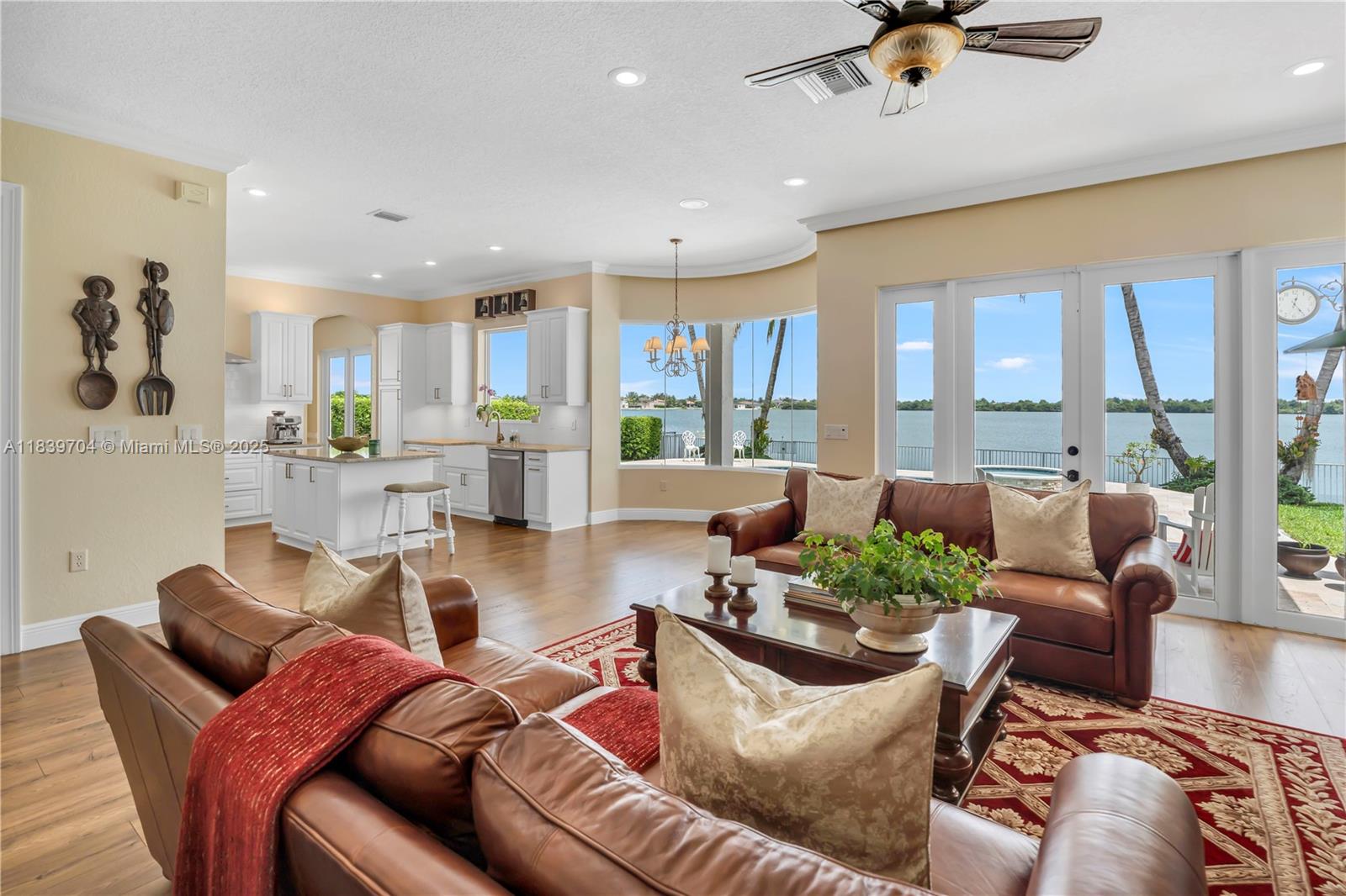 Welcome to your dream home in the prestigious, guard-gated Sunset Lakes! This stunning 5BD/4BA, 2-story lakefront pool home sits on a quiet cul-de-sac and offers luxury and privacy. Enjoy a fully renovated kitchen with granite counters, subway tile backsplash, double ovens, stainless appliances, and a breakfast nook. Two oversized primary suites include sitting areas and private balconies. Luxury vinyl wood flooring flows throughout. The fenced backyard is a tropical oasis with travertine pavers, covered seating, and a heated pool with jacuzzi—all overlooking the serene lake. Watch peaceful sunrises and sunsets from your private retreat. Recent upgrades: NEW Diamond Brite pool finish, NEW A/C units, and impact windows/doors. Don’t miss out—schedule your private tour today!