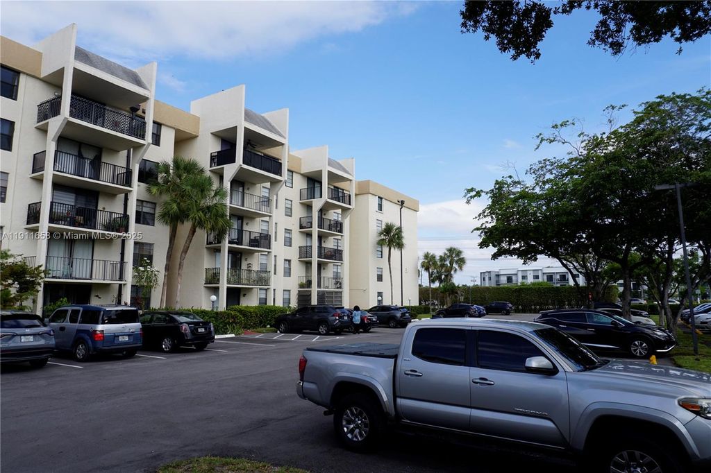 Photo of 6195 Rock Island Rd #204, Tamarac, FL 33319 (MLS # A11911658)