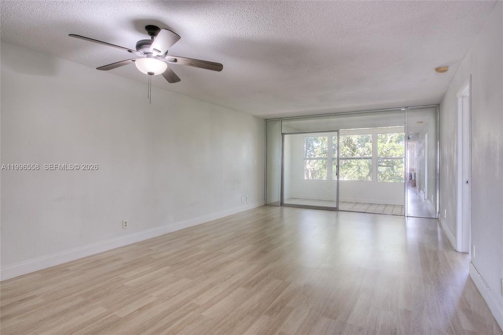 Photo of 8810 W Mcnab Rd #306, Tamarac, FL 33321 (MLS # A11996558)