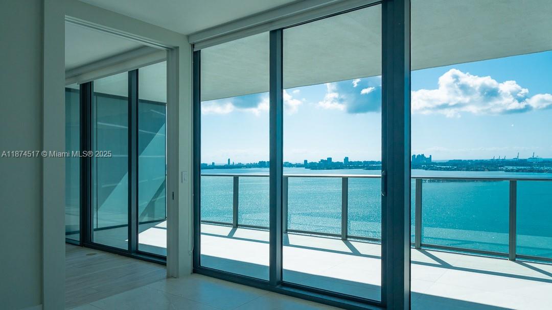 DIRECT BAY VIEWS from large balcony, living/dining room and master bedroom. 2BD/3BATH+DEN totally renovated, tile floors throughout, built-in closets, window treatments and more. Amazing Paraiso Bay Condo offering top amenities, an enormous 100 linear feet pool, gorgeous party room, private screening room with state-of-the-art multimedia facilities. Tennis center with 2 lighted tennis courts, outdoor grill, bay front park, Amara Restaurant by Beard Award winning Chef Michael Schwartz, lobby designed by United Partners of London, private elevators, Italkraft kitchen & Sub-Zero fridge. Minutes from Midtown, Design District, Wynwood and Highway.