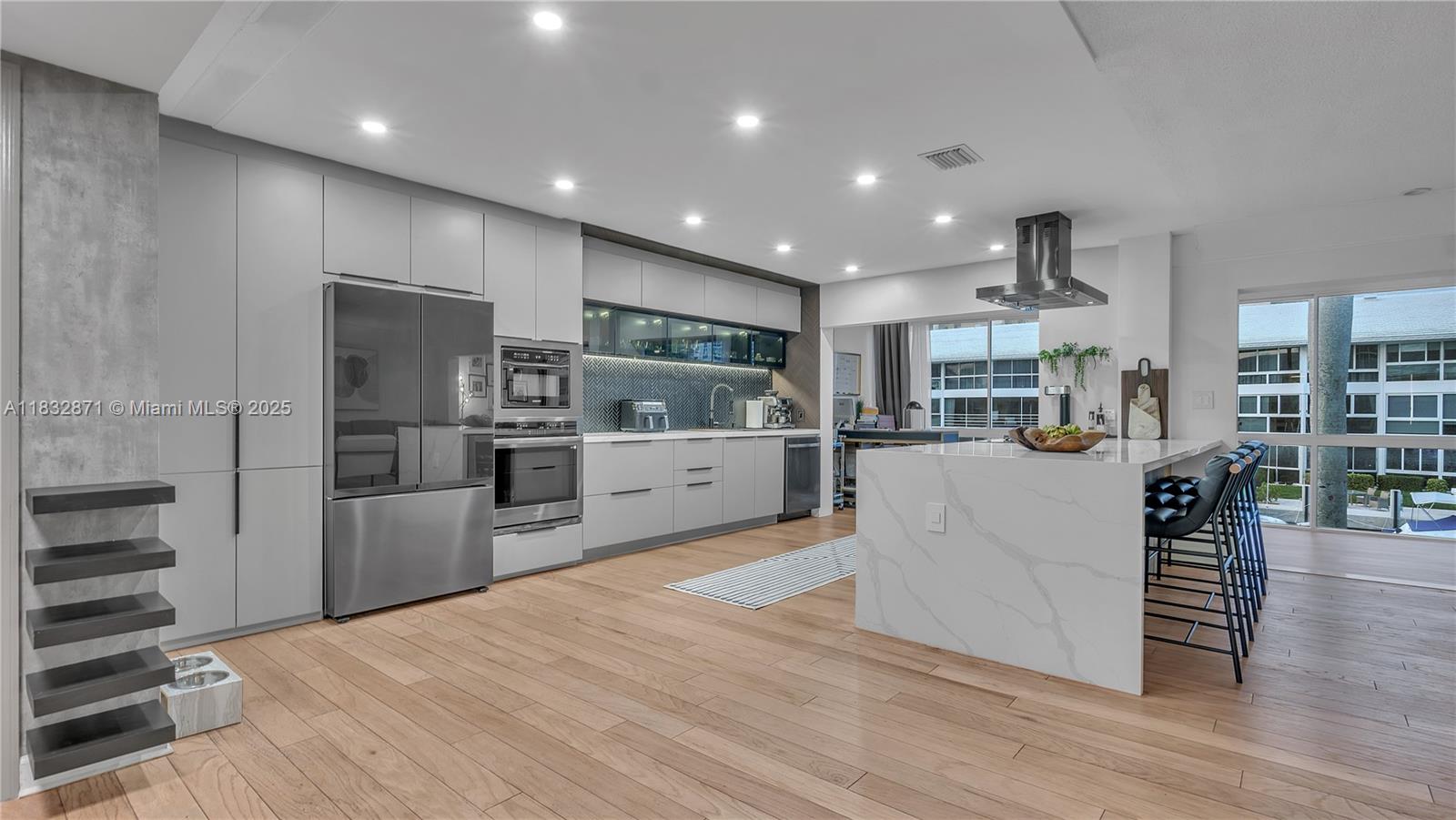 Experience luxury living in this beautifully remodeled 2-bedroom, 2-bathroom condo with breathtaking water views! Every detail has been thoughtfully designed, featuring a chef’s kitchen with an expansive island, quartz countertops, and top-of-the-line appliances—perfect for entertaining. The open-concept layout is flooded with natural light through large windows, creating a bright and airy ambiance. Both bathrooms have been exquisitely remodeled with high-end finishes. Enjoy peace of mind with a new roof assessment already paid by the seller. Boat lovers rejoice! A dock is available for rent, accommodating boats up to 45 feet. Located just minutes from restaurants, bars, shopping, and within walking distance to the beach.
