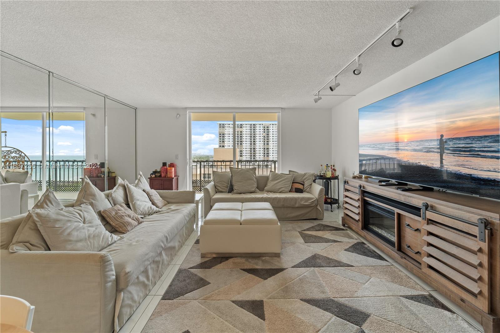 Welcome to this stunning 2-bed, 2-bath condo just steps from the sand in Hollywood Beach. Spanning 1330 square feet, this residence offers a relaxed and comfortable lifestyle. Enjoy endless views of the ocean, intracoastal and city. Upon entering, you are greeted by a spacious living area with ample natural light. The kitchen is equipped with granite counters and modern appliances. The primary bedroom features an en-suite bathroom and offers a peaceful retreat. Oxford Towers boasts a range of amenities, including a billiards room, ping pong table, a recreation room and a gym, ensuring there's always something to enjoy. The pool and sauna provide a perfect place to relax and unwind. Outdoor features include a barbecue area and a common outdoor space, ideal for entertaining guests.