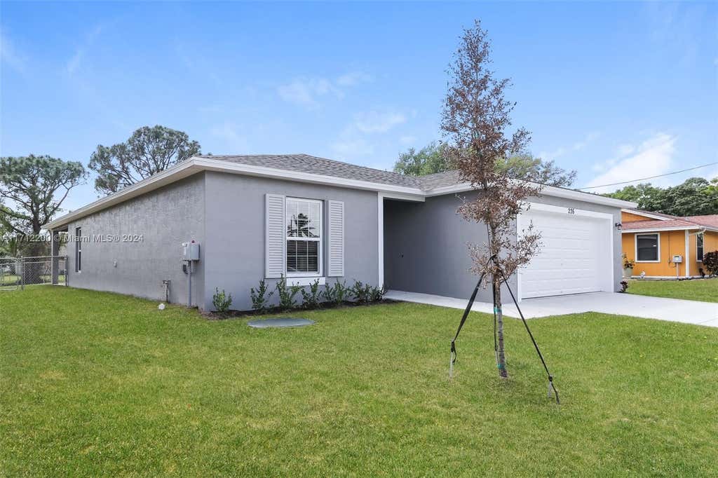 Photo of 226 SW Eyerly Ave, Port Saint Lucie, FL 34983 (MLS # A11712200)