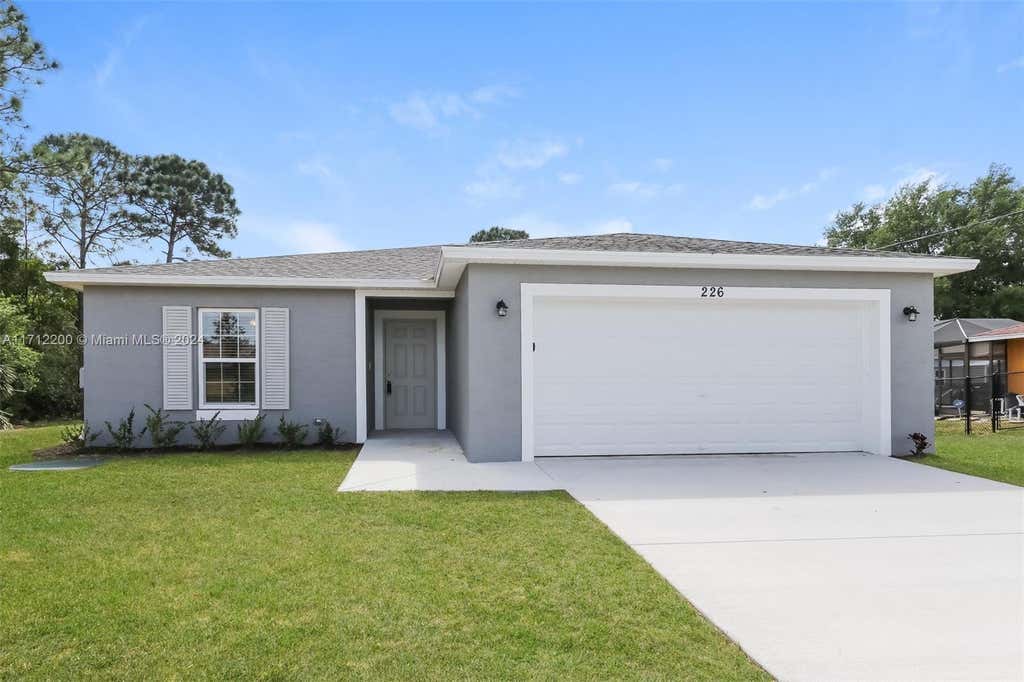 Photo of 226 SW Eyerly Ave, Port Saint Lucie, FL 34983 (MLS # A11712200)