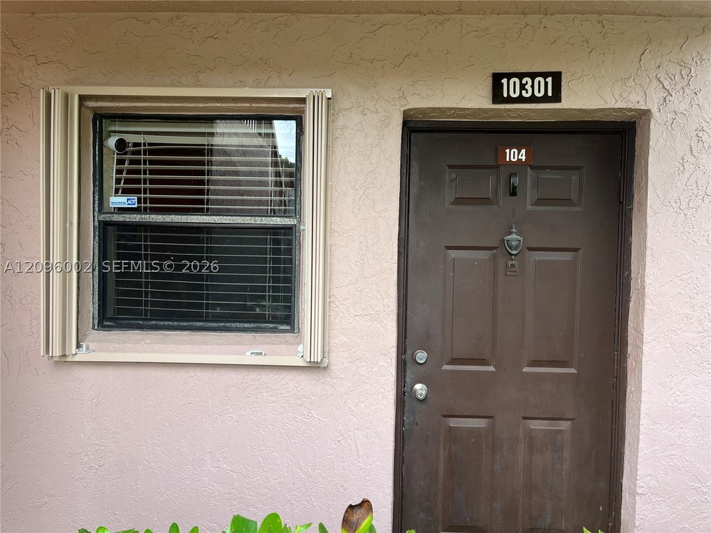 Photo of 10301 NW 11th St #104, Pembroke Pines, FL 33026 (MLS # A12096002)