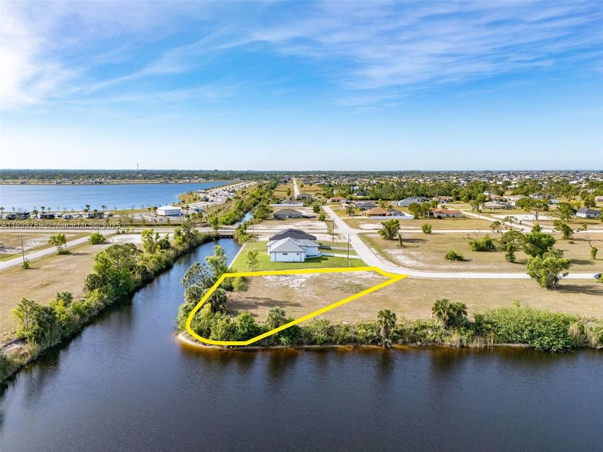 Oversized Triple Lot.43 acre with Stunning Waterfront Views!! Are you looking for the perfect property to build your dream home or vacation home? Boasts 190 feet of waterfront along with breathtaking intersecting canal views—a dream setting for your future home. Located in a thriving area with new construction homes, including two brand-new homes right next door, this property offers both beauty and convenience. Less than 10 minutes from Burnt Store Marina, providing boat storage, waterfront dining, & more. Sirenia Vista Park a few miles away, perfect for kayaking, paddleboarding, fishing, or nature walks. Matlacha, a top fishing and dining destination, is only 10 miles away. Everyday essentials are close by, Publix less than 8 miles away & Coral Oaks Golf Course just 10 minutes away.