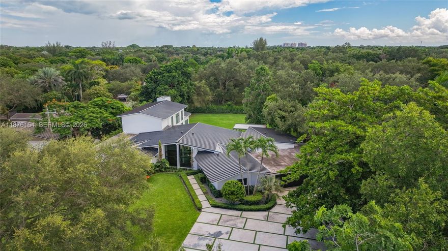 Nestled on over an acre of lush, private grounds in sought-after Pinecrest, this stunning 5-bedroom, 5.5-bathroom residence offers over 6,000 square feet of elegant living space designed for comfortable family life and entertaining.
Step inside to discover a beautifully updated interior featuring a brand-new kitchen with premium finishes, spacious living areas filled with natural light, and a seamless indoor-outdoor flow. The home’s transitional style blends clean lines with warm accents, creating an inviting yet refined atmosphere. The oversized backyard offers endless possibilities.
In one of South Florida’s most desirable neighborhoods, this home is minutes from top-rated schools, parks, and dining—ideal for families seeking luxury, space, and convenience in a prime location.