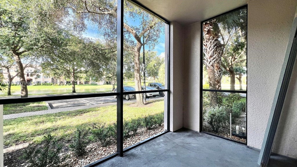 Photo of 3021 Alcazar Pl #101, Palm Beach Gardens, FL 33410 (MLS # A12077099)