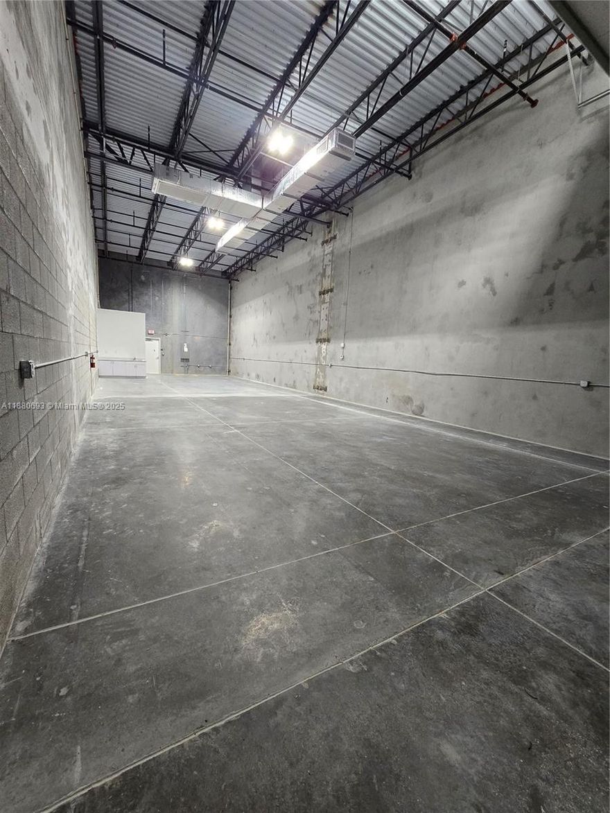 New construction meets flexibility in this 1,989-square-foot warehouse, built in 2024. From luxury storage for cars, boats, or RVs to a smart base for your small business, this space adapts to your goals. Highlights include climate control throughout, hurricane-rated garage doors, soaring 20’ ceilings, fire sprinklers, shower-ready bathrooms, Located in Homestead’s thriving industrial corridor—minutes from the Sports Complex, Miami Speedway, and major highways. This warehouse positions you for growth and convenience in one of South Florida’s fastest-rising markets.