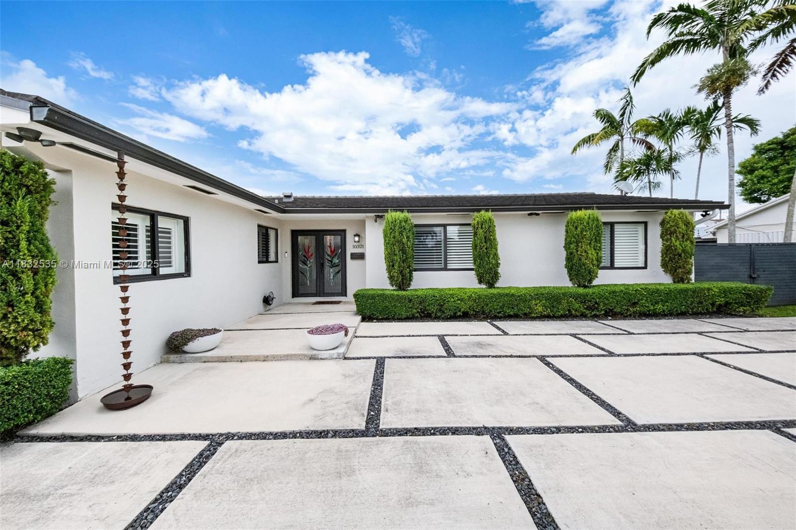 Welcome to your dream home in the prestigious Killian Palms Country Club neighborhood. This stunning 4 Bed, 2 Bath residence has been fully remodeled to perfection with no detail spared. Step inside to an open, sunlit layout with a sleek, modern kitchen and spacious living areas, ideal for entertaining. Outside, a completely upgraded pool deck and lush, resort style landscaping create your own private paradise. This home also features custom California closets throughout, an advanced alkaline water filtration system, and elegantly upgraded plantation shutters. Enjoy peace of mind with a new roof and A/C. This is a rare turnkey opportunity in one of Miami’s most coveted neighborhoods. Gym can be easily converted to 5th bedroom. Property is larger than tax roll per floor plan (2621 SQ FT).