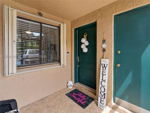 Photo of 205 Lakeview Dr #103, Weston, FL 33326 (MLS # A12060881)