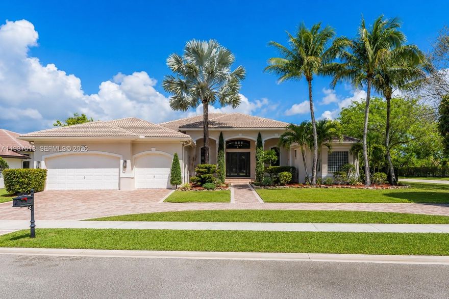 Stunning lakefront home located in the exclusive guard-gated community of Riverstone in West Davie. This spacious residence features six bedrooms and five full bathrooms, including three en-suite bedrooms.
Grand living space with volume ceilings and a formal dining room, creating an open and impressive layout. Designed for entertaining, the home features a step-down wet bar with beverage cooler, over 4,200 square feet of custom granite flooring, and 8-foot high interior and exterior doors throughout.The primary suite includes dual vanities, a soaking tub, and an oversized custom marble walk-through shower. The home is equipped with a tankless water heater, three newer AC units (2020+), and hurricane-impact doors, providing full hurricane protection. Designed for entertaining both inside and out, the outdoor space features a summer kitchen, tropical landscaping, and a resort-style pool area. The patio is fully enclosed with hurricane shutters, and a cabana bath provides direct access to the pool. The pool was remodeled in 2020 and includes a saltwater system, new heater and pumps, and full automation controlled via app. Tall privacy hedges surround the large one-plus-acre corner lot.
Community amenities include a guard-gated entry, pickleball courts, basketball courts, pavilion, and playground. Riverstone is conveniently located near Vista View Park, highways, shopping, dining, airport, and hospital.
Move-in ready and meticulously maintained.