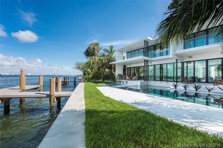 New modern home on the wide Bayfront, built w/ highest quality materials/finishes, fully completed. Features: open floor plan, wall-to-wall glass doors, Poliform kitchen w/ island, glass wine cellar, Calacatta marble & wood floors, floor-to-ceiling Italian doors, floating stairway w/ glass railings, elevator, roof top deck. Upstairs, luxe master w/ direct water views, lg terrace, Poliform closets, marble bath. Exterior: pool, Jacuzzi, summer kitchen, new seawall/dock. Built by On One Group.