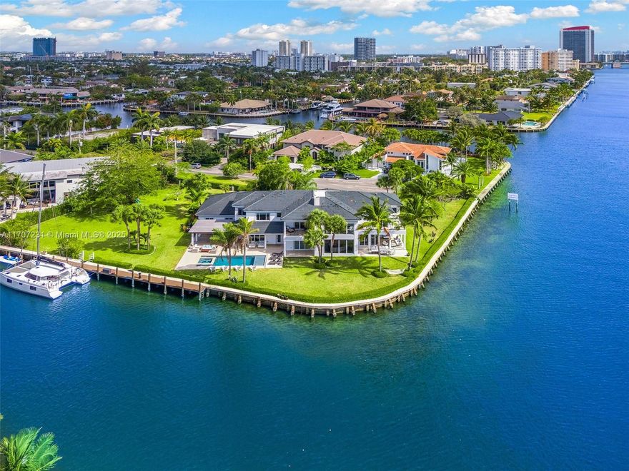 Experience unparalleled luxury on one of the finest point corner properties in Golden Isles. Spanning a spacious 38,844 sqft, this oversized double lot, originally three parcels combined into two, features an extraordinary 420 ft of water frontage.” This property captivates with unobstructed picturesque western bay views of Golden Beach skyline. This exquisite 7-bed, 9.5-bath home has been meticulously renovated & includes a separate guest house. A private oasis awaits in the beautifully landscaped front yard & pool area, entirely secluded from the street. Enjoy soaring ceilings throughout, an expansive master suite with generous walk-in closets, & a lavish windowed master bath designed for indulgence. Golfers paradise! Just a few minutes away from exclusive golf & tennis resort.