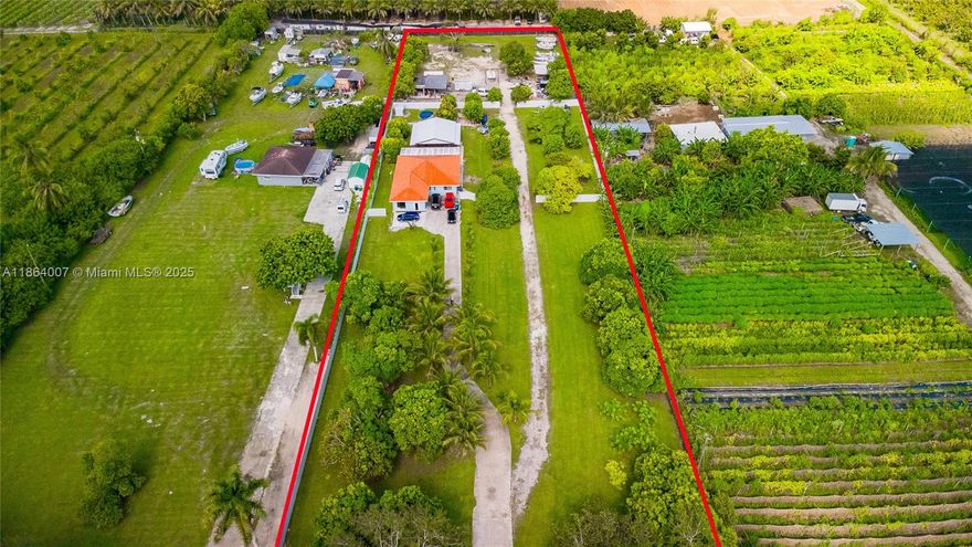 This stunning Homestead farm-single family home boasts 3 bedrooms, 2 bathrooms, stainless steel appliances, and tile flooring throughout. Situated on a spacious 2.35 acre lot, this property is a true farm lover's dream with mango, guava, lychee, and many other fruit trees. Enjoy the serene surroundings from the new gazebo or relax in the updated back porch. The modern family room is perfect for entertaining guests or simply unwinding after a long day. With impact windows and a remote control front gate, security and convenience are top priorities in this home. Located near Krome Ave and the entrance of the Florida Keys, this property offers the perfect blend of tranquility and accessibility. Whether you're looking for a peaceful retreat or a place to call home, this property has it all.
