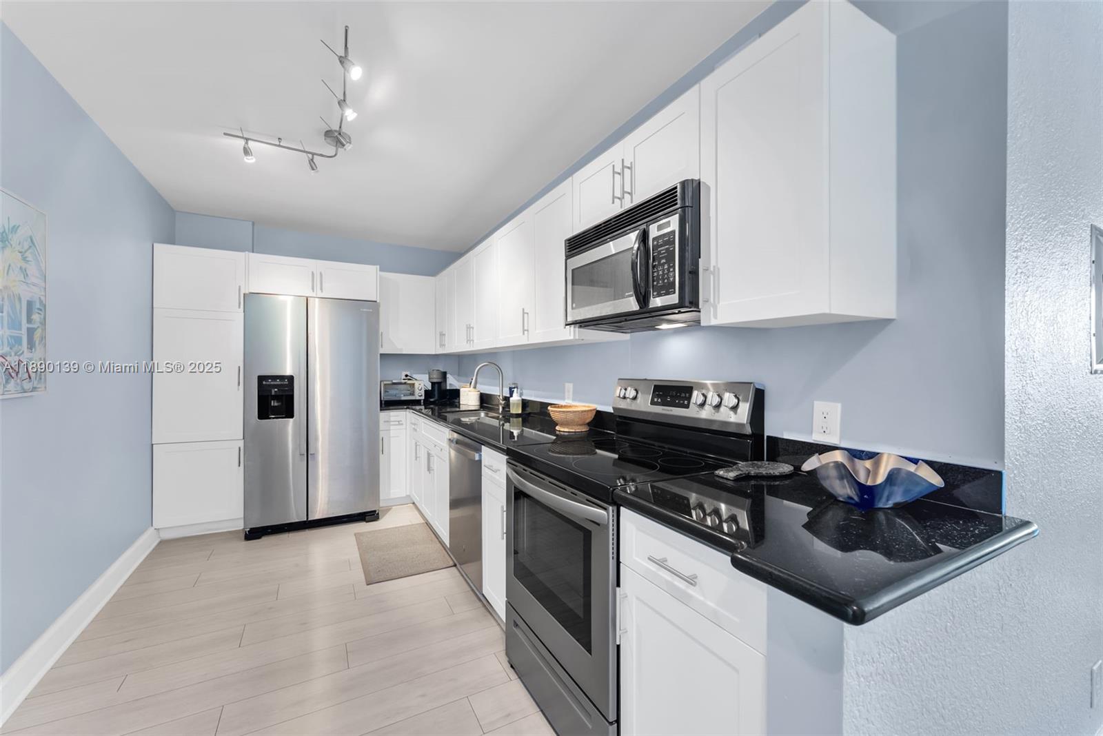 Experience unobstructed ocean, bay, and Miami skyline views from this beautiful 1/1 at 401 BLU. This south facing unit on high floor just under the PH is flooded with natural light and features many upgrades including white kitchen cabinetry, granite, SS appliances, high ceilings w/ crown moldings, wood flooring, spacious bedroom w/ large walk in closet, and large private balcony. This fully renovated high rise is located in the heart of North Beach's Town Center. With a walking score of 95! Publix, shopping, many great dining options, entertainment, and your beach entrance are all just outside your door. 401 BLU has excellent financials! Fully funded with big reserves & no assessments. Amenities include 24/7 front desk, roof top pool, gym, bike room, and covered secured parking.