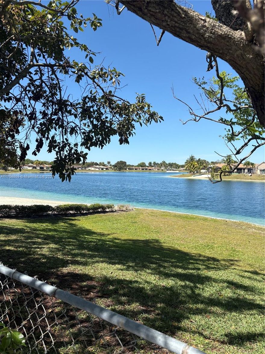 CORNER BEACH AND LAKE FRONT!!! Excellent area at entrance of Devon Aire #4, new hurricane impact doors and windows. Super location cross the street to many restaurants, banks, doctors offices, beauty salons and 1/2 block from turnpike.