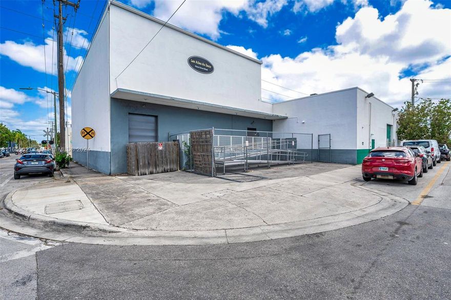 Located in the thriving Allapattah neighborhood of Miami, this +/-15,000 SF industrial building sits on a 17,493 SF lot and was built in 1954. The refrigeration/cold storage warehouse space comprises approximately +/-10,000 square feet and includes office space. With a ceiling height of 15 feet, this space features 1 dock height loading door and 1 oversized street level loading door, providing easy access for trucks and deliveries.. The performing arts studio is +/-5,000 square feet and boasts a ceiling height of 28'. Recently renovated with new electrical, plumbing, HVAC, and bathrooms, this space is currently being used as a circus school, making it perfect for  any business that appreciates high ceilings.

The 7,125 SF vacant lot across the street is also available at $1,000,000.