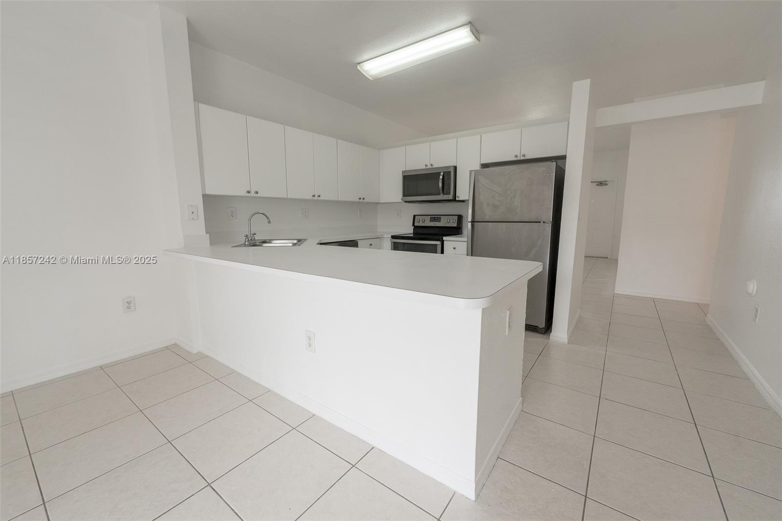 Beautiful spacious 3 bed 2 bath apartment at San Marco villas. Enjoy a large open kitchen with white cabinets, a
spacious family room, a garden view, tile throughout, and a washer and dryer inside the unit. Master bedroom has
a walk-in closet and attic storage. The unit has been freshly painted, is vacant, and is ready to rent. This complex
is located in Miami Lakes with close proximity to I-75, Palmetto 826, and the Turnpike. It has shopping centers,
churches, parks, schools, and a country club minutes away for your enjoyment. One assigned parking spot and
plenty of visitor parking.