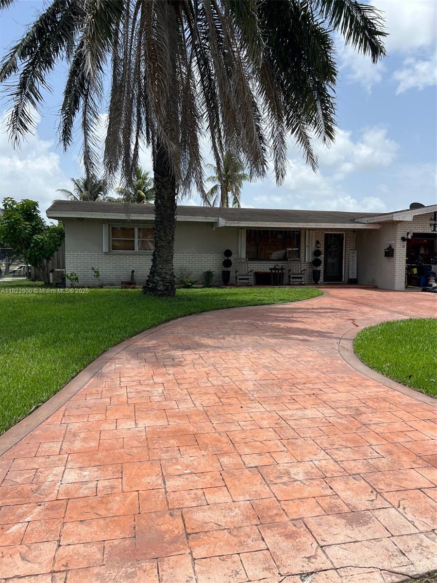 Enjoy peaceful lakefront living in this well-kept home with spacious interiors and beautiful outdoor views. The open layout features a bright living area and an updated kitchen with stainless steel appliances. Step out to the covered patio and large backyard overlooking the water—ideal for relaxing or gathering with friends. Additional features include durable vinyl flooring, and a dedicated laundry room. Please note, the garage was converted to a bedroom/storage space prior to the current owner’s purchase. Don’t miss the chance to see it in person- schedule your showing today!