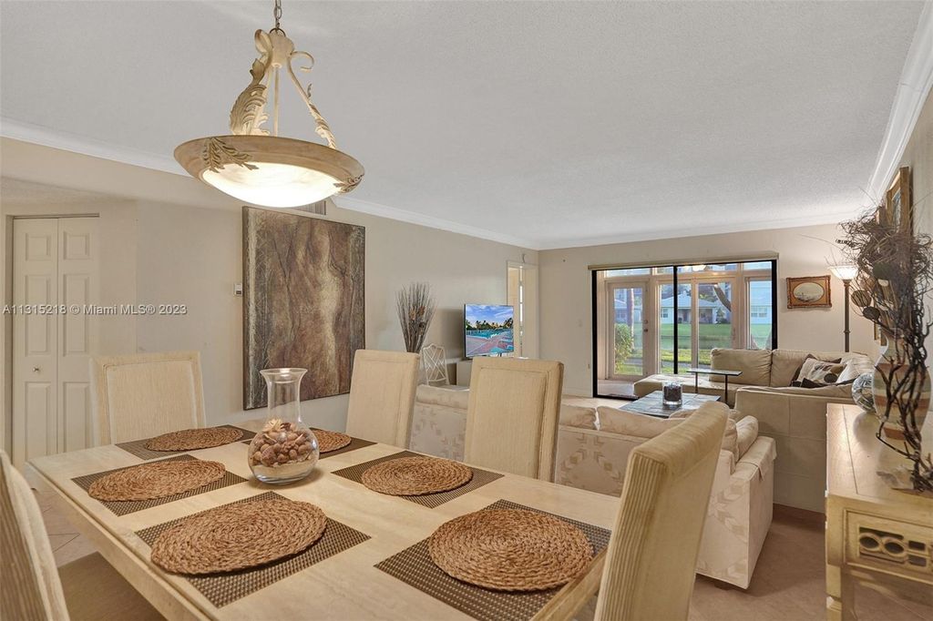 Photo of 7290 Kinghurst Dr #105, Delray Beach, FL 33446 (MLS # A11315218)