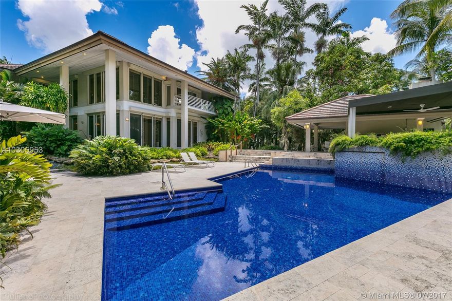 This spectacular 2-story waterfront home was completely renovated in 2010 and features a bright and open floor plan, soaring ceilings, and beautiful high-end finishes. 5 bedroom plus maids/in-laws quarters. Chef’s kitchen with Subzero appliances, triple ovens, and gas range also boasts a fabulous breakfast nook embraced by views of the pool patio and foliage. Outdoor amenities include headed pool, summer kitchen, and 58 ft dock. Enormous basement and storage room are a huge bonus area. Ample 2 car garage. Located in the exclusive Islands of Cocoplum, this residence sits in a corner lot for maximum privacy with direct access to Biscayne Bay.