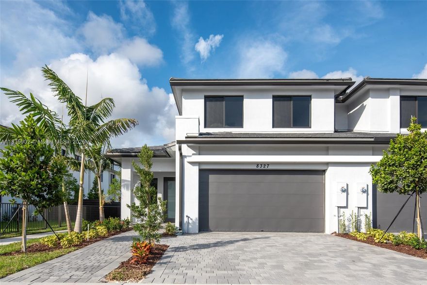 Stunning 2023 CENTRIS townhouse in a prestigious boutique gated community, west side of US1, Pinecrest Zipcode. This 4-bedroom, 3-bathroom home features the largest floor plan, including a family room, open great room, and 2-car garage. Premium Wolf/Sub-Zero kitchen, quartz counters, and elegant porcelain/plank flooring throughout. A private, covered terrace overlooks the park, offering direct access to the green spaces. Hurricane-impact windows/doors and Ring security system included. Walk distance to A-rated schools: a block to Vineland Elementary, 0.8mi to Palmetto High, 1.8mi to The Falls Shopping. Community amenities include a pool and a clubhouse. Perfect for families seeking luxury, security, and convenience in a prime location.