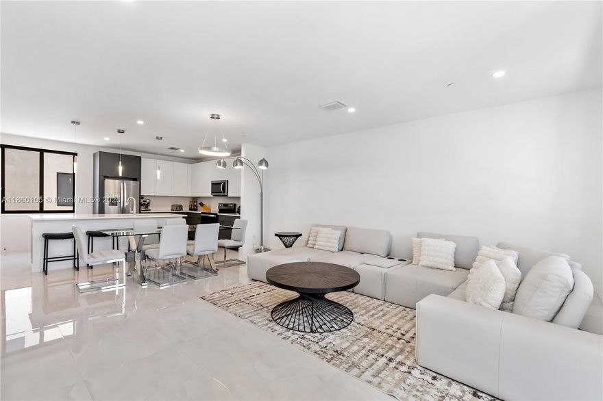 This newly built 2023 tri-level townhome delivers exceptional value in sought-after Poinciana Park. Located just minutes from Las Olas, Downtown Fort Lauderdale, top-rated dining, shopping, beaches, and major highways, this 3-bedroom, 3.5-bath residence offers a modern, open layout ideal for elevated living. The first-floor guest suite provides flexibility, while the gourmet kitchen boasts quartz countertops, designer lighting, and elegant tile throughout. Each bedroom includes a private en-suite bath, and the expansive primary suite features double sinks and oversized custom closets. Natural light fills the home, complemented by a private balcony and spacious 2-car garage. Don’t miss your chance to own luxury living in the heart of Fort Lauderdale—now at an UNBEATABLE LOW PRICE!!