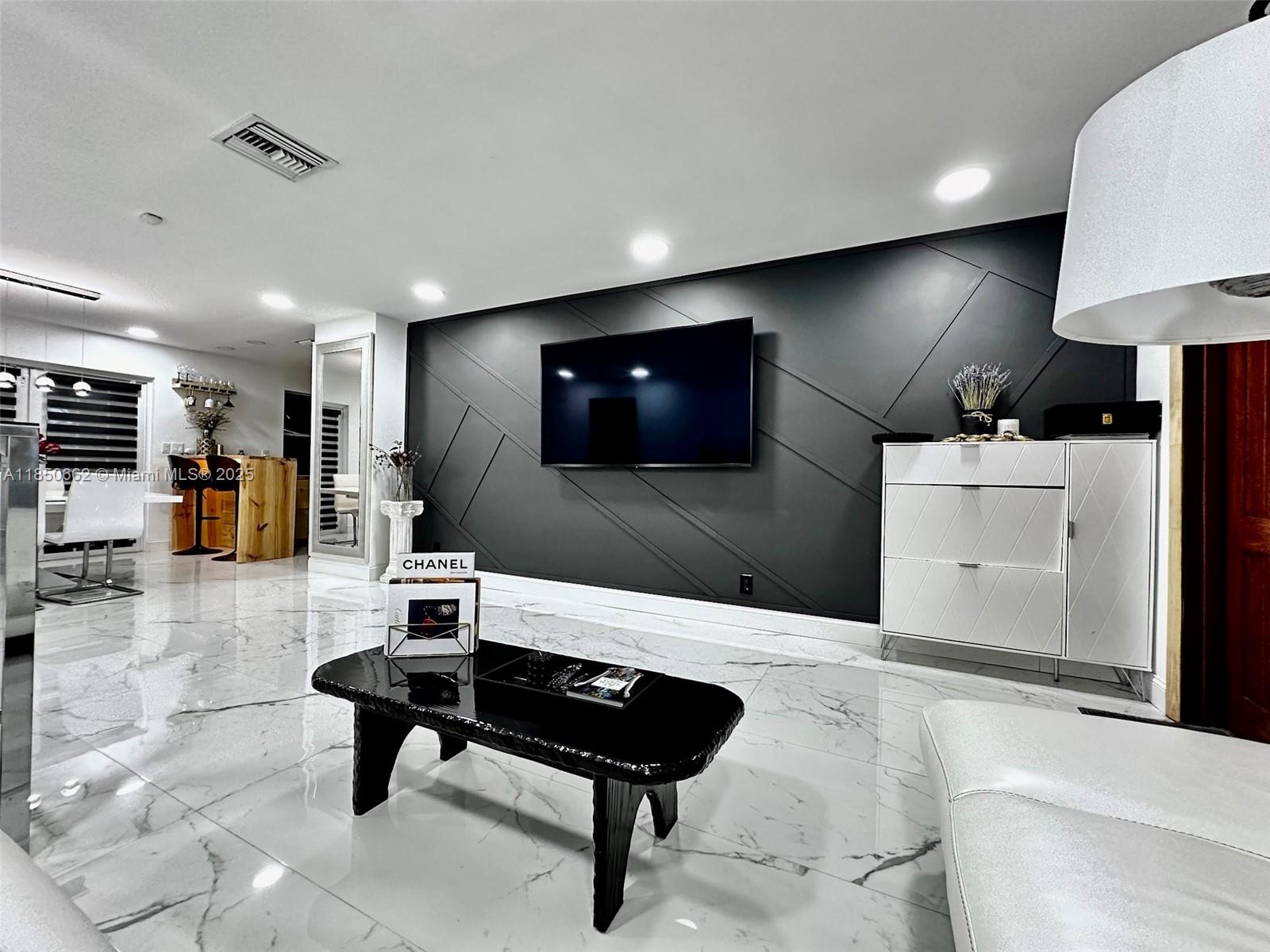 Fully remodeled in 2025, this stunning 3-bedroom, 2-bath single-family home offers style, comfort, and smart living. Featuring a modern kitchen with new appliances, central A/C, energy-efficient LED lighting, and a smart home system with Alexa integration. The spacious layout includes a laundry zone with washer & dryer, and a screened patio perfect for relaxing evenings***Enjoy a beautifully landscaped backyard with a koi pond, built-in grill area, ambient lighting, and multiple seating zones. The front yard also offers a cozy sitting area and parking for two cars, plus additional street parking***GREAT LOCATION! Just minutes from the beach and the rapidly developing Dania Pointe area, with nearby restaurants, Publix, Walmart, shopping plazas, and more***Available furnished or unfurnished.