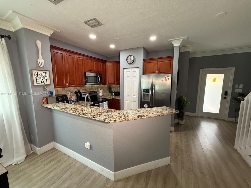 Welcome to this beautifully updated 3-bedroom, 2-bath home showcasing a bright open layout with modern finishes throughout. Enjoy the sleek upgraded kitchen, brand new recessed lighting, and the peace of mind that comes with all impact windows and doors. Spacious bedrooms and stylish bathrooms complete the home, while the outdoor space is perfect for relaxing or entertaining. With a motivated seller, this property is priced to move—schedule your showing today!
