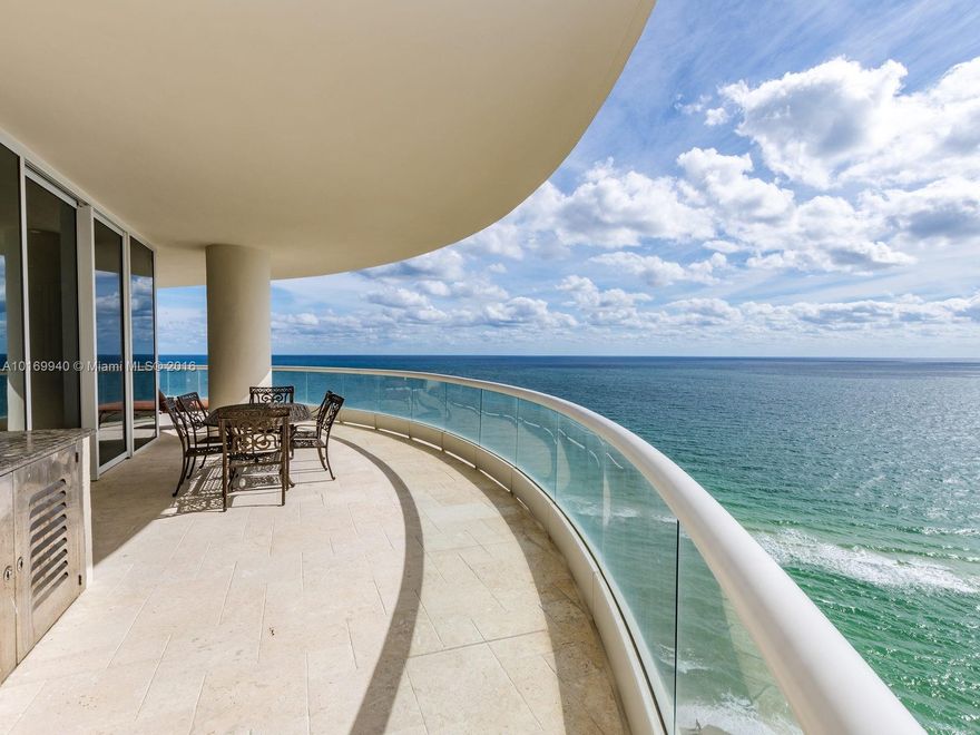 Gorgeous Direct Ocean and bay views from this SE corner 4 bedroom + maids room, 6.5 bath upgraded residence.  1500 sq ft wrap balcony + second balcony facing sunset. Top of the line kitchens & bathrooms.  Cistern & Lu-tron for control of electronics throughout the house.  160 ft of ocean front for this country club on the ocean.  2 pools, beach service, restaurant, bar, hotel style spa, full gym w/classes, concierge, valet. 5 star service. Private dinners & functions, kids club and more