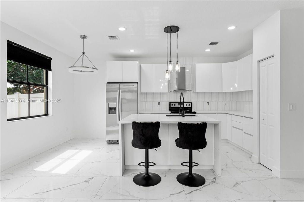 Photo of 4814 NW 56th Ct, Tamarac, FL 33319 (MLS # A11846303)