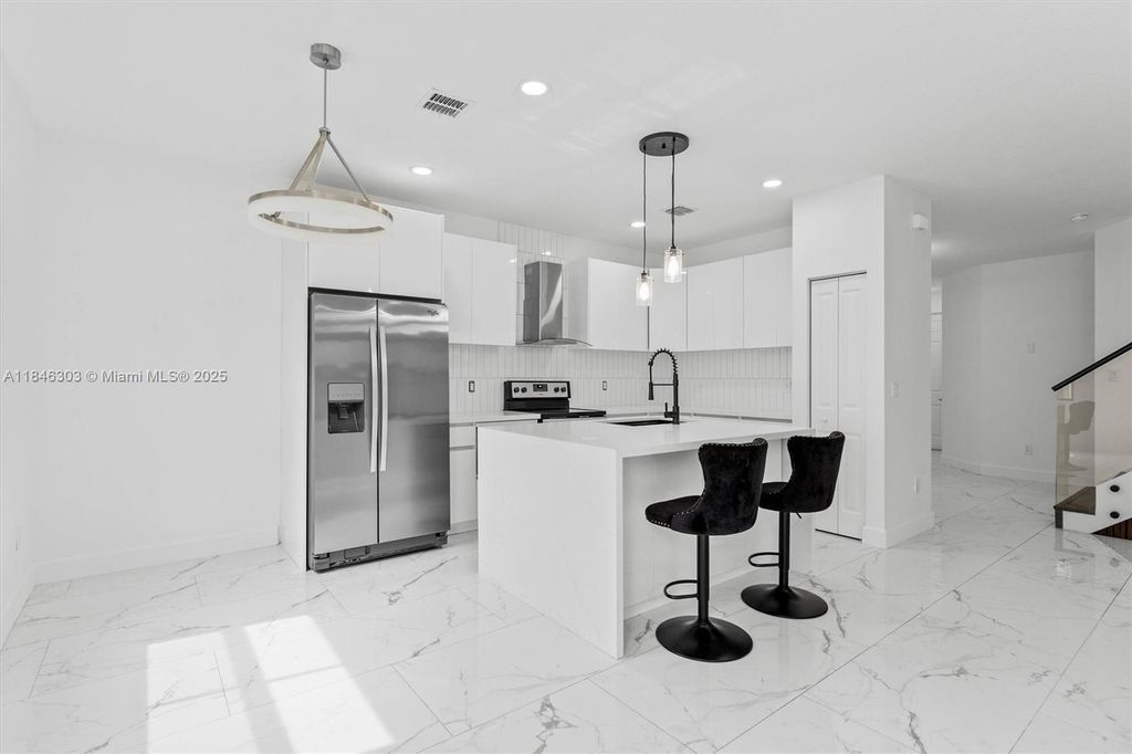 Photo of 4814 NW 56th Ct, Tamarac, FL 33319 (MLS # A11846303)