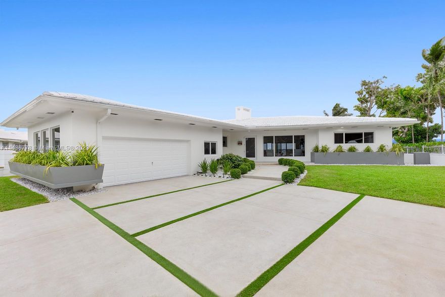 The best and Only and Best Wide Open Bay Property in Miami Shores!
Welcome to an exquisite waterfront retreat in the heart of Miami Shores. This 4-bedroom, 3-bath home seamlessly blends modern design with timeless charm. Enjoy open living spaces, a gourmet kitchen, and stunning views. Step into the master suite for waterfront panoramas. With 94 feet of waterfront and 14,000 sq ft of land.
This property's prime location along the open bay waterfront makes it a must-have for boat enthusiasts. With easy access to the ocean through Haulover, it offers a unique opportunity at an affordable price compared to similar Miami properties. Wide Open Bay properties are rare, so don't miss your chance.
4th bedroom and 3rd bathrooms are inside the Garage and are used like an office.