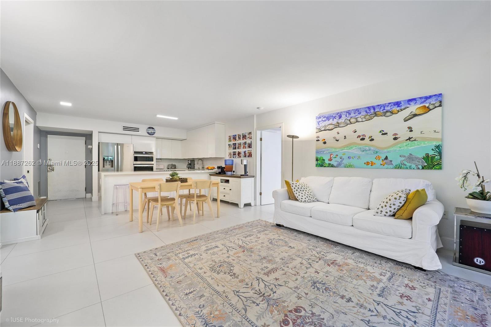 BEACH CLUB MEMBERSHIP INCLUDED! At the entrance of Key Biscayne! FULLY RENOVATED! PRIVATE! Corner unit! Plenty of natural light! Spacious 2bed/2bath + ENCLOSED DEN, which can be turned into a large 3rd room or office. Hurricane windows and doors. Green views. White kitchen with SS appliances, plenty of counter space. Recessed LED lighting. Stacked washer/dryer inside unit. Walk in closets. Two pools, jacuzzi, BBQ area, party room, gym. Assigned parking near the unit. Plenty of guest parking. 24-hr security gate. Beach access steps away. Close to Crandon Park, schools, shops, restaurants, community center. Free golf cart rides available within KB. Easy access in and out of the island to Brickell, Downtown, highways, airport and seaport. A must see! AVAIL JAN 1, 2026.