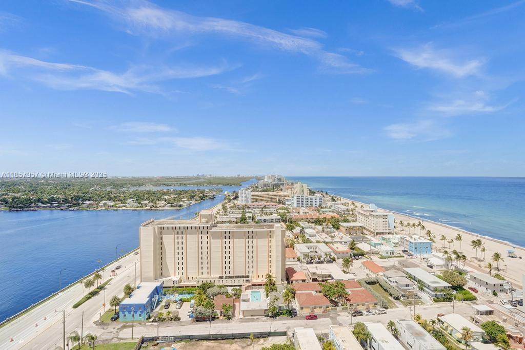 Amazing, forever views of ocean & intracoastal waterway! Right on the Broadwalk with cafes and entertainment! Brand new impact doors & windows provide energy efficiency & soundproofing. Double ensuite floorplan. Full kitchen, wood cabinets, granite tops, stainless appliances, formal dining & breakfast area. Tile & wood flooring. Water views from every room! 2 parking spaces in secured garage. Loads of closet space. Laundry closet. Full service building has 2 heated pools, tennis, pickleball, puttting green, cardio room, weight room, game rooms, fabulous BBQ area, restaurant on site, 24 hr secured lobby & garage. Monthly includes wi-fi, cable TV, reserves, on site management (First Residential) & maintenance crew. Minutes to air and sea ports. 40 yr inspection complete. Bldg has reserves.