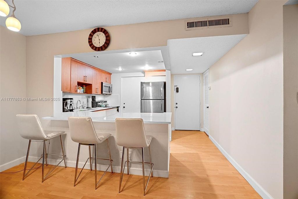 Photo of 2313 S Cypress Bend Dr #222B, Pompano Beach, FL 33069 (MLS # A11777853)