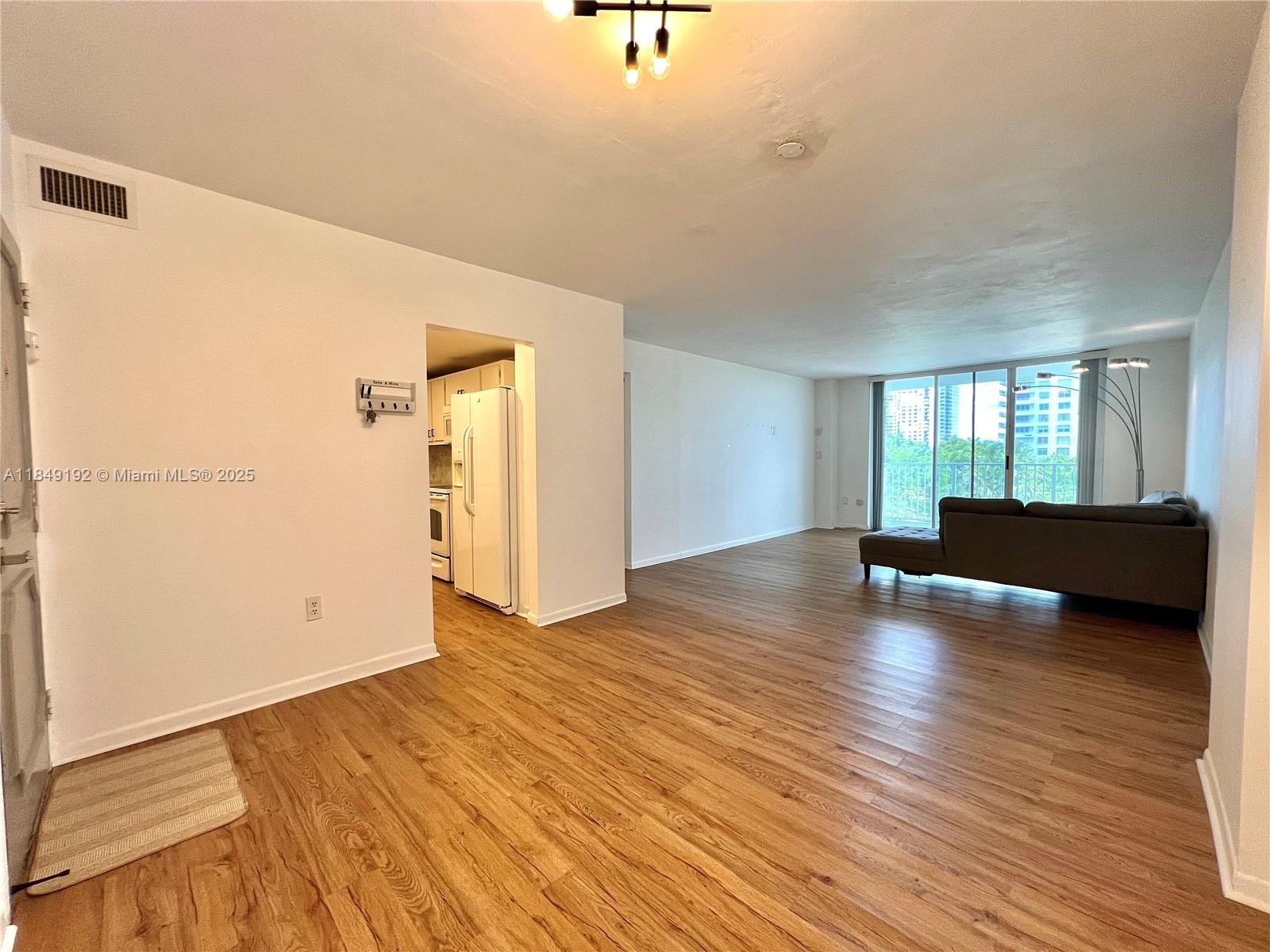 Stunning and highly sought-after, this 4th floor 2-bed, 2-bath condo is located in the heart of luxurious Aventura. The property boasts an open concept layout, new quartz countertops, kitchen backsplash, beautiful garden view from the private balcony, smooth ceilings, luxury vinyl plank flooring throughout, and beautiful views from each bedroom. 1 assigned parking space with plenty of guest parking available for the owners, and laundry machines on each floor. The building offers 24/7 surveillance, a gym in the east building, tennis courts, basketball courts, bbq grills, and 2 pools. Walking distance to the temple of worship (Synagogue), Aventura Mall, Publix, Costco, I-95, US-1, and just a few minutes drive to the beach. Easy to show! We present all offers.