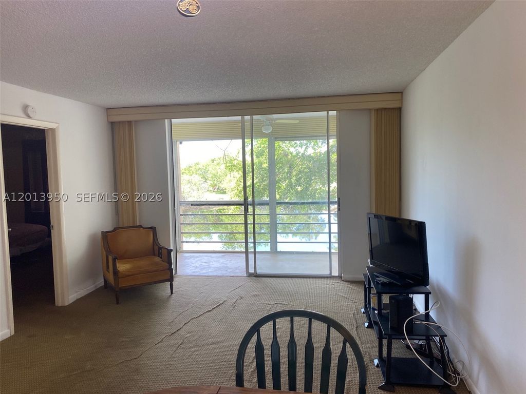 Photo of 9370 Sunrise Lakes Blvd #209, Sunrise, FL 33322 (MLS # A12013950)