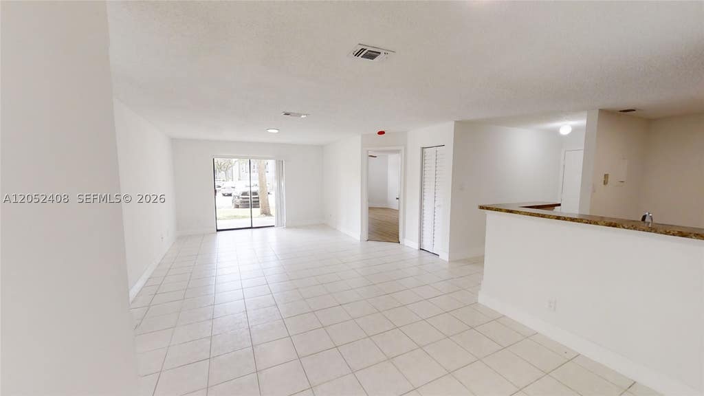 Photo of 11255 W Atlantic Blvd #106, Coral Springs, FL 33071 (MLS # A12052408)