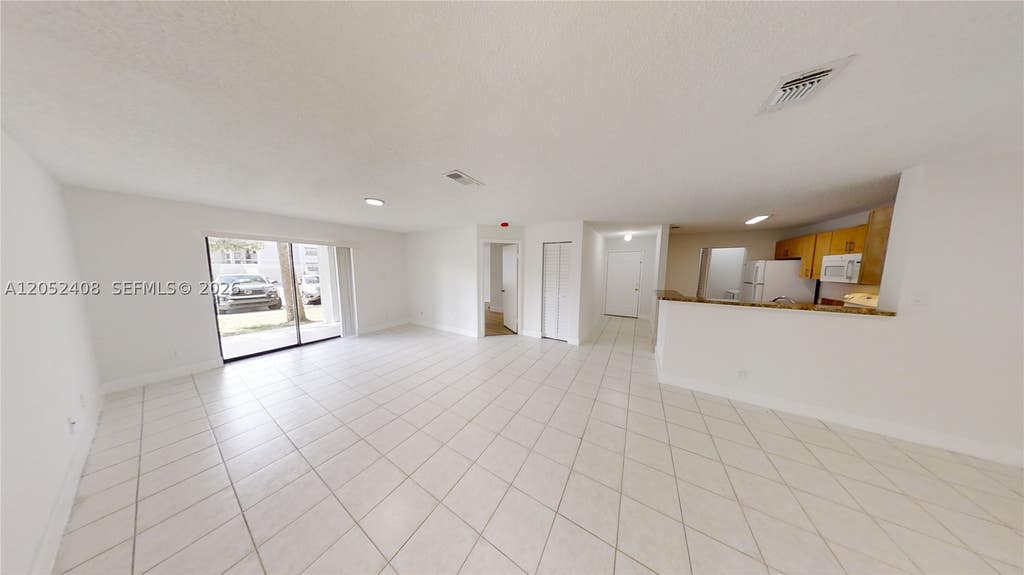 Photo of 11255 W Atlantic Blvd #106, Coral Springs, FL 33071 (MLS # A12052408)