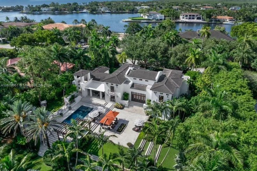 The only turnkey property in Gables Estate below $50M. 555 Arvida is an incredible investment in the most desirable zip code in the world. This exquisitely crafted Mediterranean compound boasts breathtaking views and direct ocean access. The double height, chic living space flows to an executive office, billiard room with salt water aquarium, 5000-bottle wine cellar, grand dining room, gourmet kitchen. The opulent primary suite boasts a spa-like oasis. 3 additional bedrooms and 2 staff quarters offer comfort and convenience. Entertainment options abound w/ media room, gym, outdoor covered terrace spaces, infinity-edge pool, summer kitchen, private 100’ dock (180’ water frontage). Gables Estates’ residents enjoy privacy, security and world-class amenities including Tennis Club.