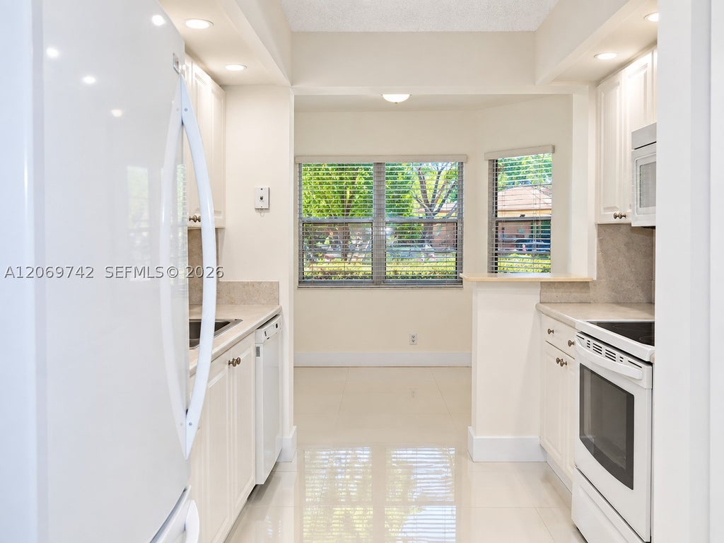 Photo of 500 SW 130th Ter #109A, Pembroke Pines, FL 33027 (MLS # A12069742)