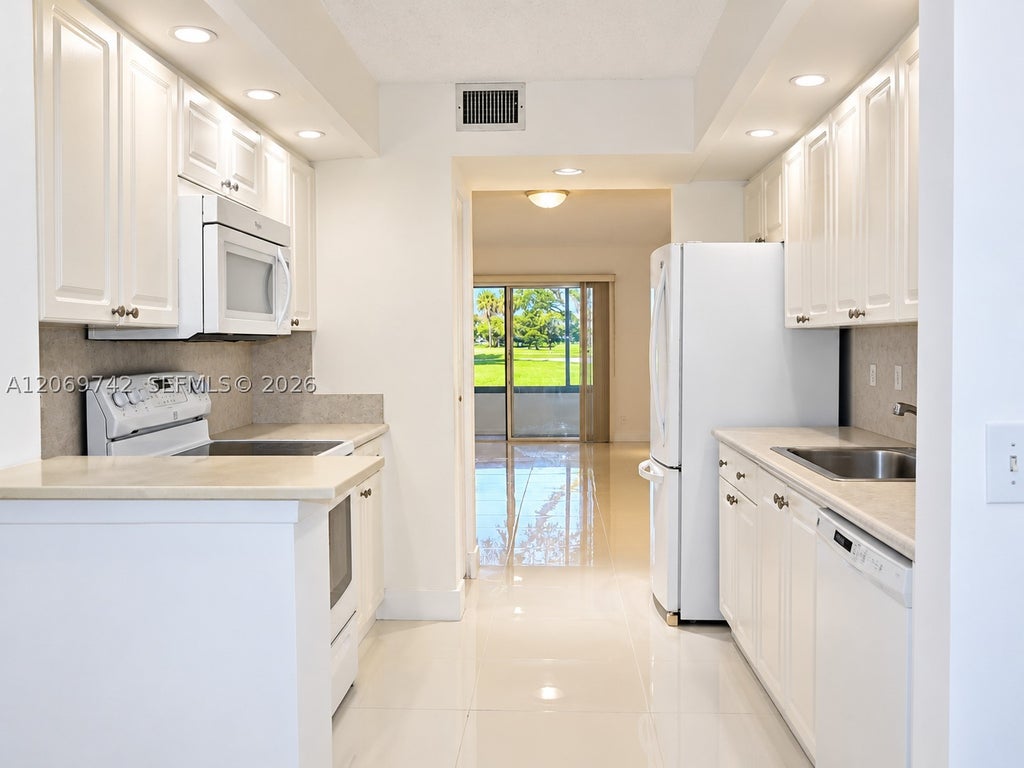 Photo of 500 SW 130th Ter #109A, Pembroke Pines, FL 33027 (MLS # A12069742)