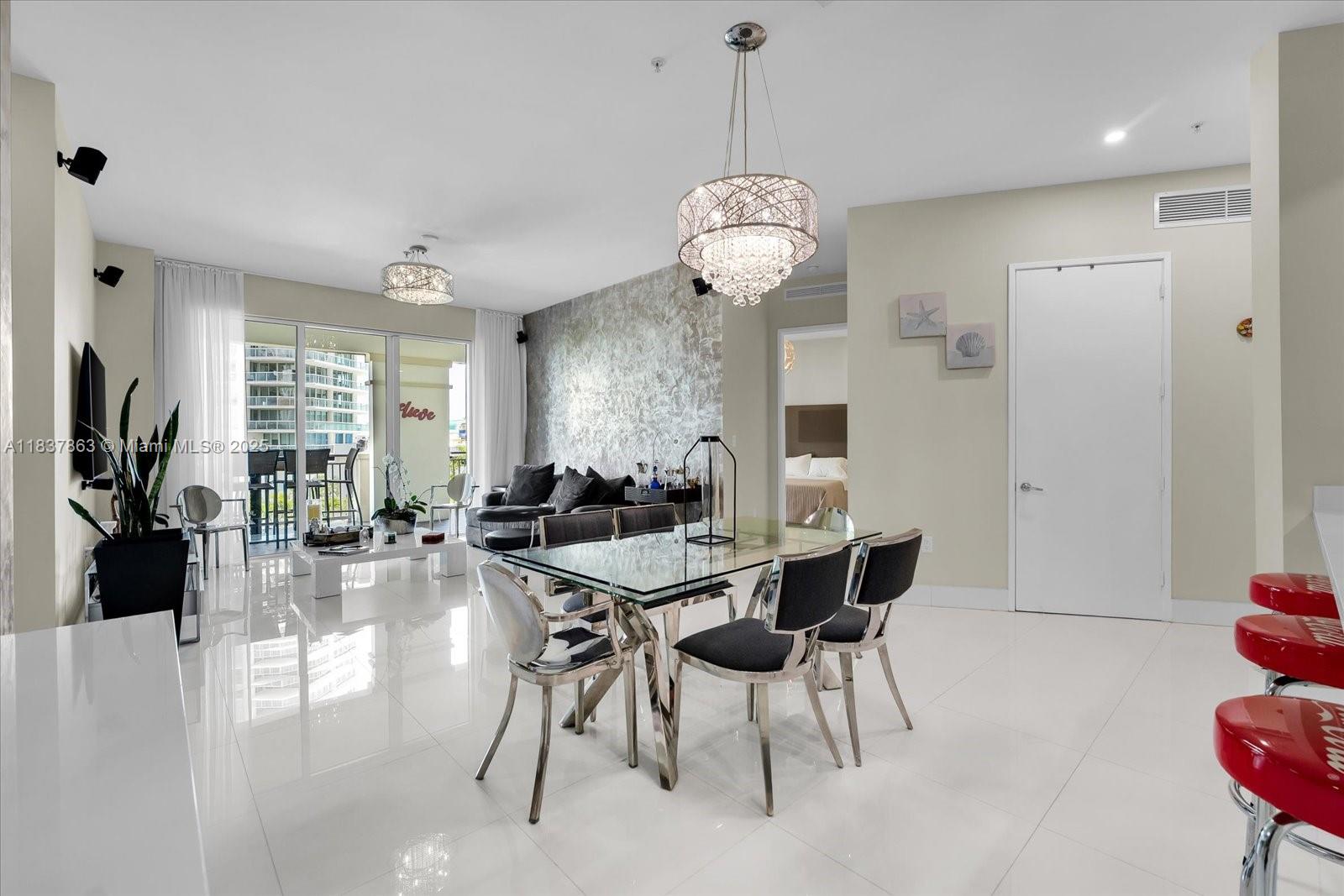 Enjoy convenience and comfort in this 3-bedroom townhome at 200 Sunny Isles Blvd. This residence offers high ceilings, a spacious layout and balcony with peaceful canal views. With 3 garage spaces—2 assigned and 1 valet—located on the same level as the unit, access is simple and direct. Thoughtfully designed for everyday living, this home is just minutes from the beach, parks, dining, and shopping. A great opportunity in a desirable Sunny Isles location.