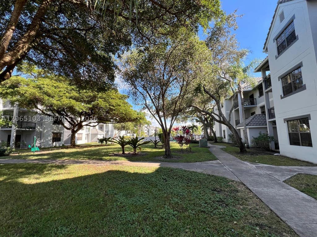 Photo of 11277 W Atlantic Blvd #304, Coral Springs, FL 33071 (MLS # A12065103)