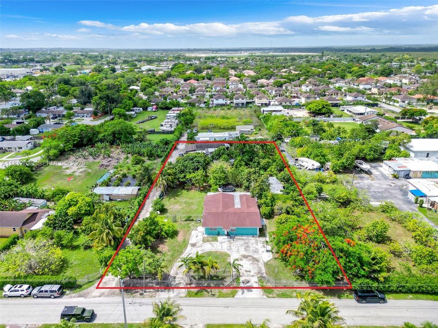 This 1.25-acre estate presents a rare investment opportunity in Homestead, featuring a 5-bed, 3-bath single-family home with approximately 2,438 sq ft of living space. The property includes a separate mother-in-law or rental quarter, creating immediate income potential. Set on a fully fenced lot with mature fruit trees, it offers both privacy and versatile use, from residential living to hobby farming or expansion. A large workshop provides space for storage, business use, or value-add projects, and the property is zoned agricultural/residential, allowing flexibility for future development or farming. There’s also RV/boat parking and plenty of room to add amenities such as a pool. It’s an ideal choice for investors seeking a high-upside asset in a growing market.