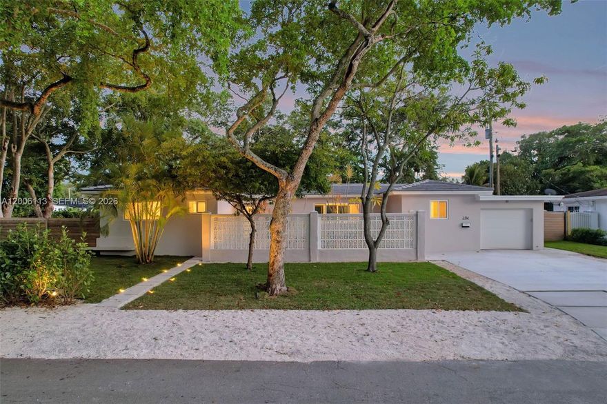 Meet the Breeze Block Courtyard Oasis. A thoughtfully reimagined 3BR/2BA mid-century gem, beautifully restored to blend classic design with modern sophistication. The signature breeze block wall and private entry courtyard create a striking first impression and effortless indoor-outdoor flow. Showcasing preserved terrazzo flooring and iconic architectural elements, this home is reinterpreted for today’s lifestyle with authenticity and style. The newly designed kitchen offers ample storage and a cohesive aesthetic that complements the home, seamlessly opening to the dining and living areas—ideal for entertaining with natural indoor-outdoor connectivity. Step into your resort-style backyard featuring a 30' saltwater pool and a shaded pergola with jacuzzi spa, perfect for year-round enjoyment. Set on an oversized lot, the property offers endless possibilities with ample room for expansion or to create your ultimate outdoor retreat. Embrace iconic mid-century modern living in this architectural gem. Move-in ready just like new construction, with comprehensive upgrades throughout, including electrical, plumbing, roof, hurricane-impact windows and doors, appliances and a brand-new driveway.