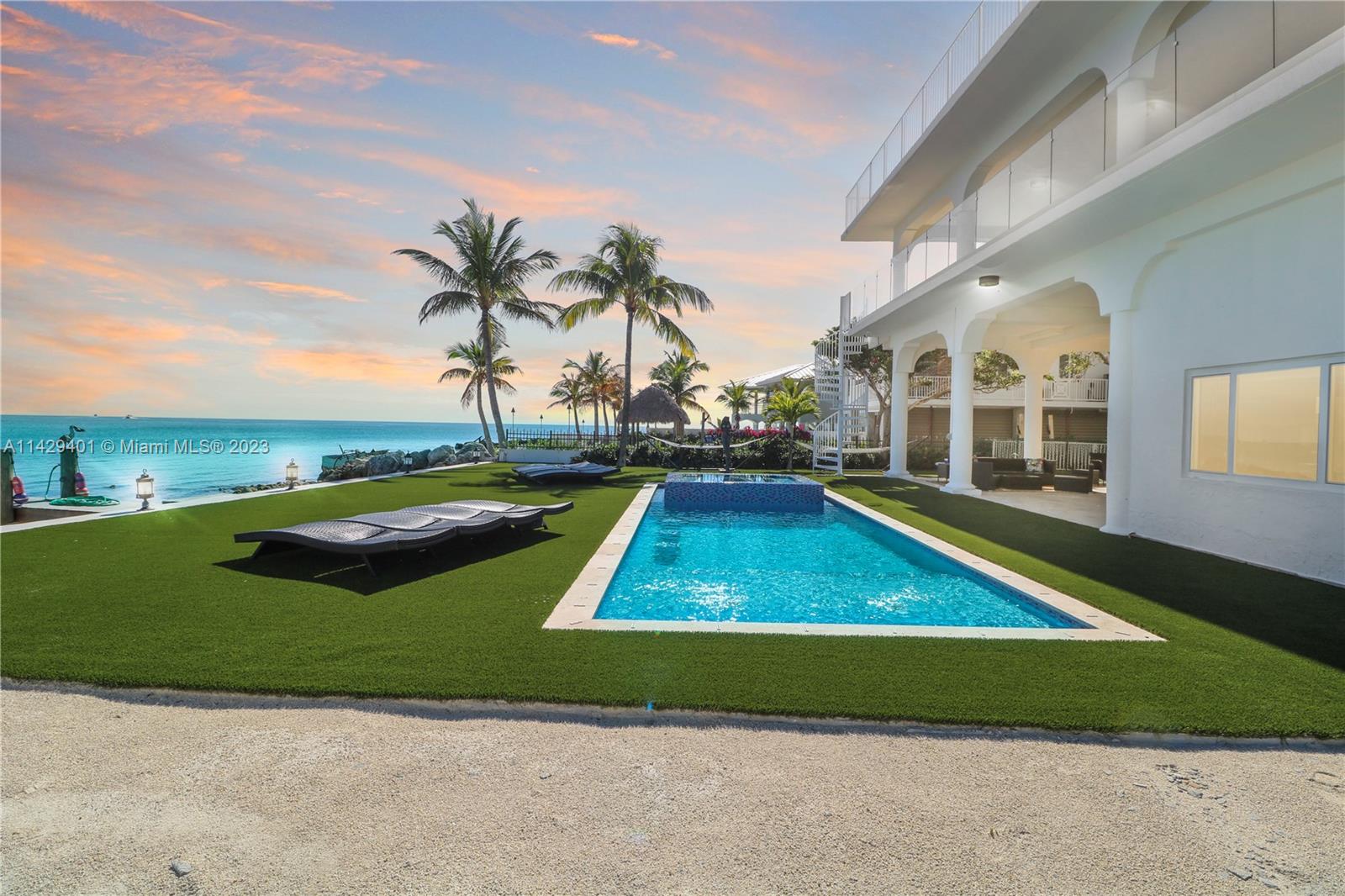 "Welcome to Paradise! This newly remodeled Key Largo, FL home offers a dream lifestyle. Updates include a sparkling pool, stylish flooring, a modern kitchen, and upgraded baths. Embrace breathtaking sunrises and sunsets, complemented by an endless ocean view. Entertain in style on the large private rooftop sundeck or the spacious ocean-view patio, perfect for gatherings with family and friends. The property features Impact Windows and Impact Glass Doors for added safety. Inside, enjoy the comfort of three beds and three baths upstairs, with an additional 1/1 downstairs. If you love fishing and diving, you'll have easy access to your favorite spots. Additionally, a new boat lift is currently under construction, making it a must-see to truly appreciate all this property has to offer.