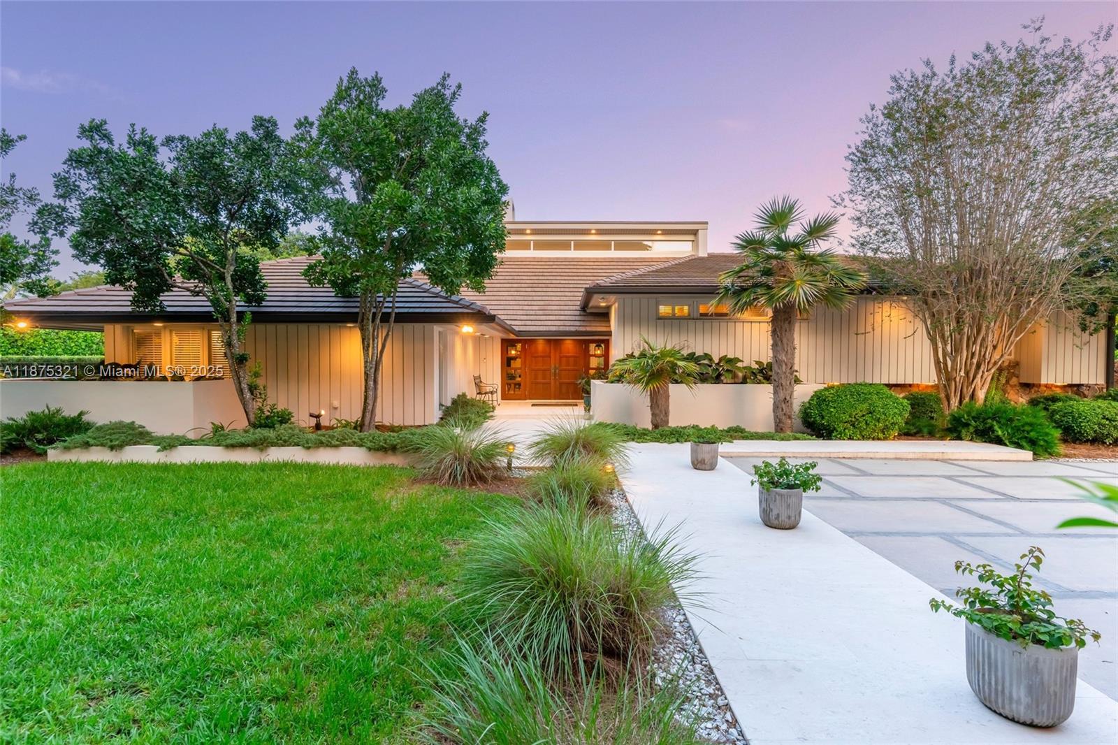 Experience timeless elegance in this 5 bed + extra room, 5.5 bath estate on an oversized 28,900 SF lot in prime Coral Gables location! Character and quality define every detail, from soaring ceilings & white-washed cedar wood accents to a grand living room with walnut/travertine bar & wood-burning fireplace. Renovated chef’s kitchen features Miele and Sub-Zero appliances with Calacatta gold marble counters and large walk-in pantry. Enjoy a massive primary suite with spa-like bath, large walk-in closet & private garden. Outdoors, resort-style living awaits with a saltwater pool, expansive deck, generous yard, and extra room with pool bathroom. Impact windows/doors & 2023 Roof. Oversized AC’d garage with extra storage. Near top schools, dining, and shops. Cocoplum lifestyle without the HOA!